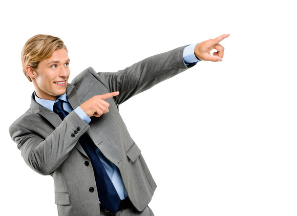 Happy businessman pointing isolated on white background - Photo, Image