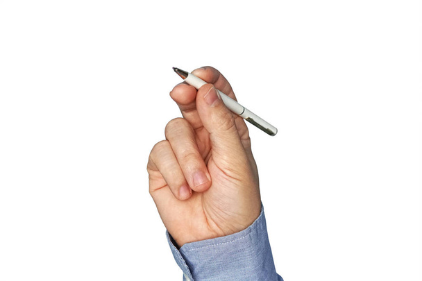 Мужская рука в синей рубашке пишет белой ручкой
 - Фото, изображение