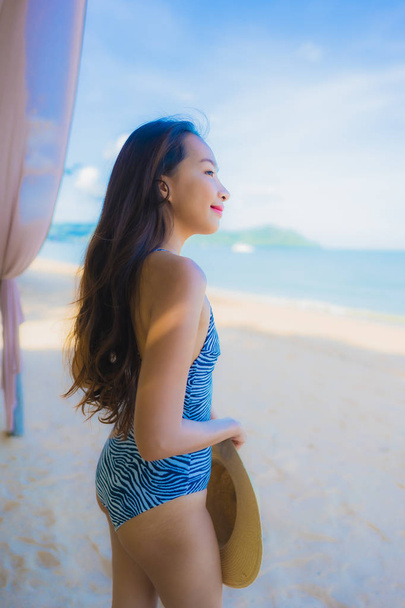 Portrait beautiful young asian woman happy smile relax on the tr - 写真・画像