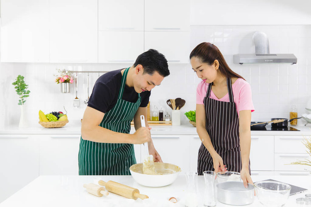 YOUNG COUPLE IN KITCHEN - Photo, Image