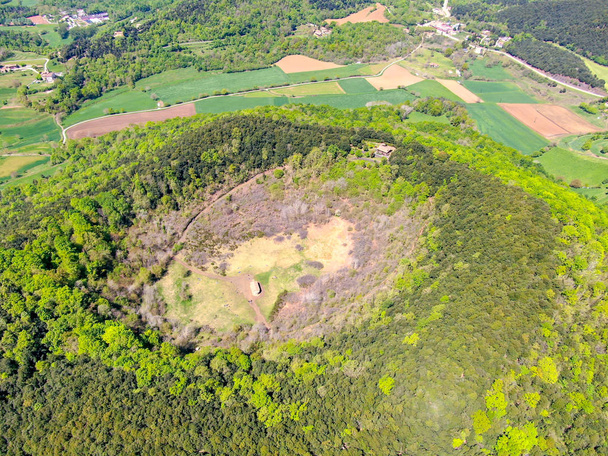 The Santa Margarida Volcano is an extinct volcano in the comarca of Garrotxa, Catalonia, Spain. The volcano has a perimeter of 2 km and a height of 682 meters in Garrotxa Volcanic Zone Natural Park - Photo, Image