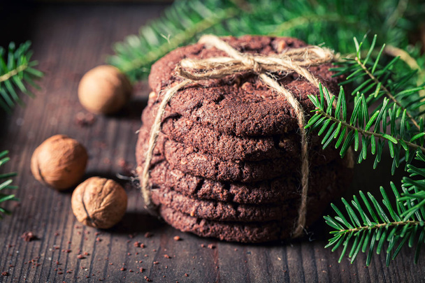 Sweet chocolate cookies with nuts as small Christmas snack - Fotografie, Obrázek