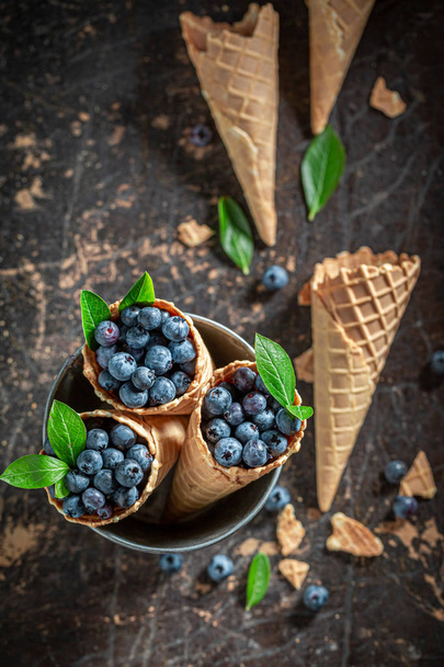 Top view of fresh blueberries in waffels as icecream concept - Zdjęcie, obraz