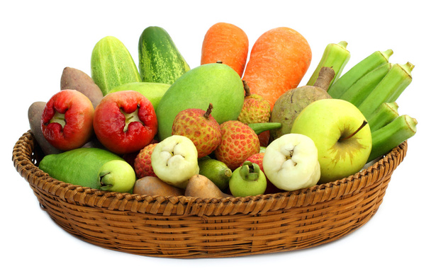 Tropical fruits and vegetables on a basket - Photo, Image
