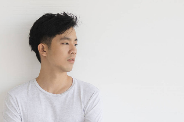 Young Asian man model in T-shirt crossed arm - Photo, Image