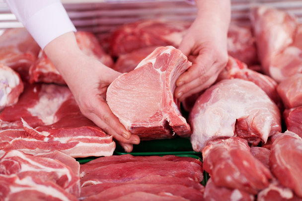 Butcher's Hands Holding Meat Piece In Shop - Photo, Image