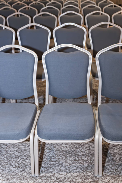 Empty blue chairs in conference hall - presentation room  - 写真・画像