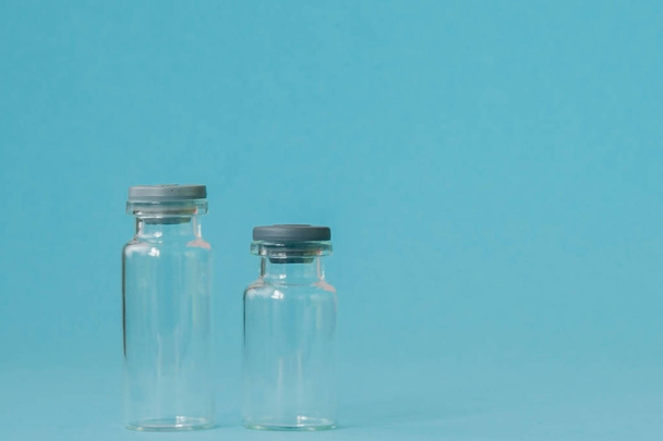 Vial of medicine on blue background with copy space. Antibiotic  - Foto, afbeelding
