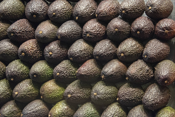 Wall of stacked avocado pears - Photo, Image