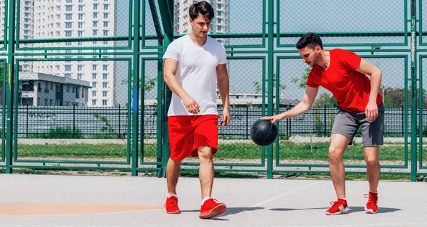 Two guys playing basketball - Photo, image
