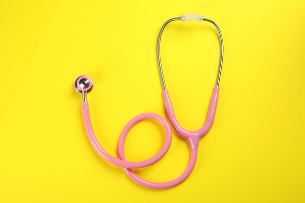 Stethoscope on color background, top view. Medical tool - Photo, image