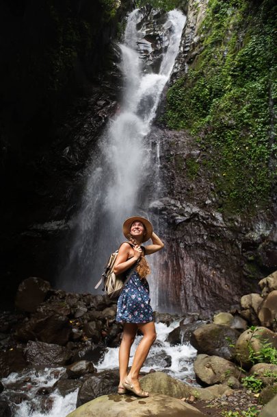 Woman near waterfal on Bali, Indonesia  - Foto, afbeelding