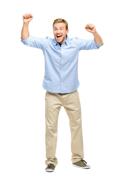 Happy young man celebrating success on white background - Фото, изображение