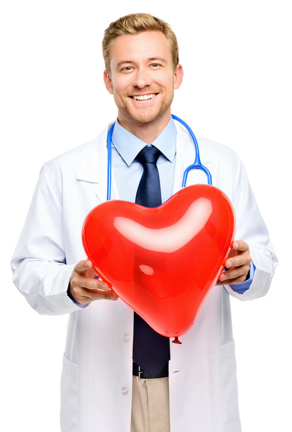 Doctor holding heart on white background - Foto, afbeelding