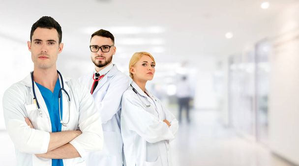 Doctor working in hospital with other doctors. - Photo, Image