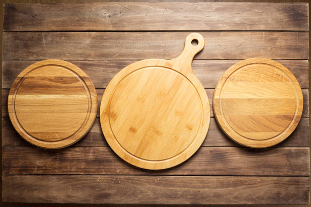 pizza cutting board at wooden plank table - Photo, image