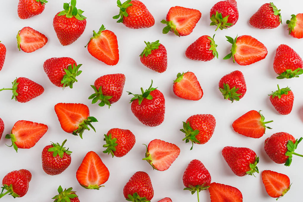 Background made from red ripe strawberry on the light background, close up shoot - 写真・画像