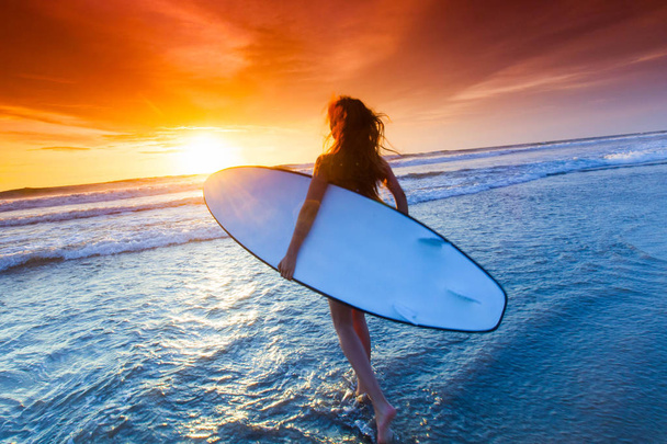 Woman with surfboard - Photo, Image