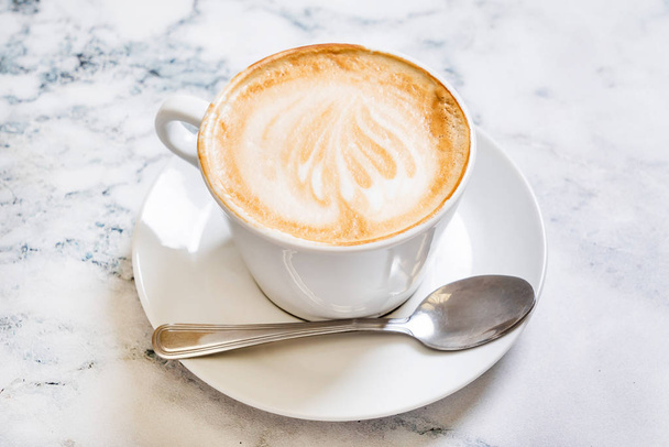 cup of cappuccino on the marble background - Foto, afbeelding