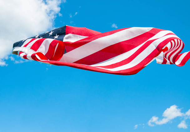 American flag in blue sky background. United States flag - Фото, изображение