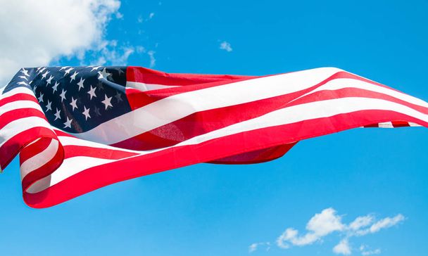 American flag in blue sky background. United States flag - Φωτογραφία, εικόνα