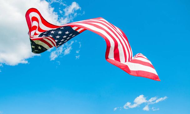 American flag in blue sky background. United States flag - Φωτογραφία, εικόνα