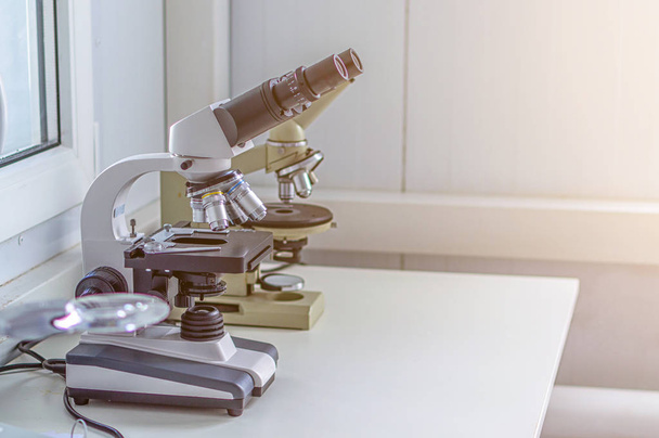 Hands with microscope in the laboratory - Zdjęcie, obraz