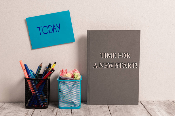 Handwriting text Time For A New Start. Concept meaning something is supposed to begin right now Fresh job Empty Sticky Card on Wall Two Mesh Pencil Pots Grey Hardcover Notebook. - Photo, Image