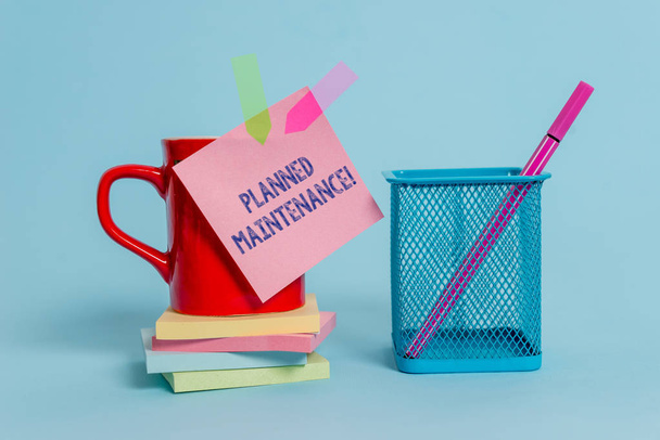 Handwriting text writing Planned Maintenance. Concept meaning Check ups to be done Scheduled on a Regular Basis Cup note arrow banners stacked pads metal pen holder pastel background. - Photo, Image