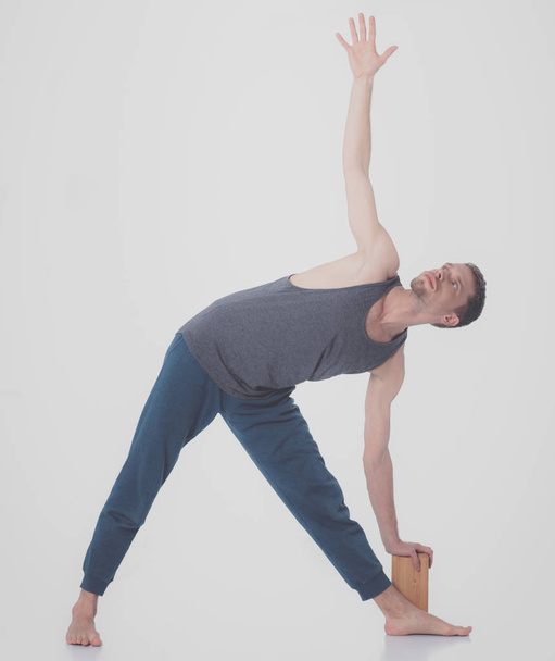 Young man practicing yoga. Yoga. Yoga Instructor - Fotó, kép