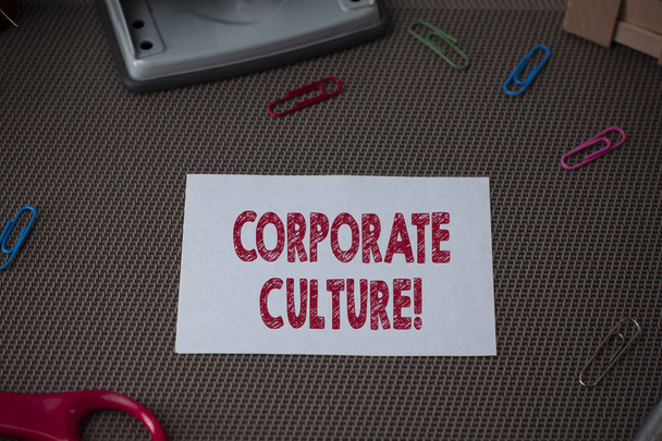 Conceptual hand writing showing Corporate Culture. Business photo showcasing Beliefs and ideas that a company has Shared values Scissor and writing equipments sheet above textured backdrop. - Fotografie, Obrázek