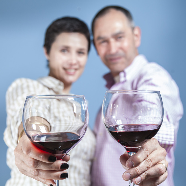 Couple toasting with a red wine - Photo, Image