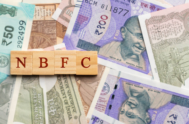 NBFC in wooden block letters on indian currency - Photo, Image