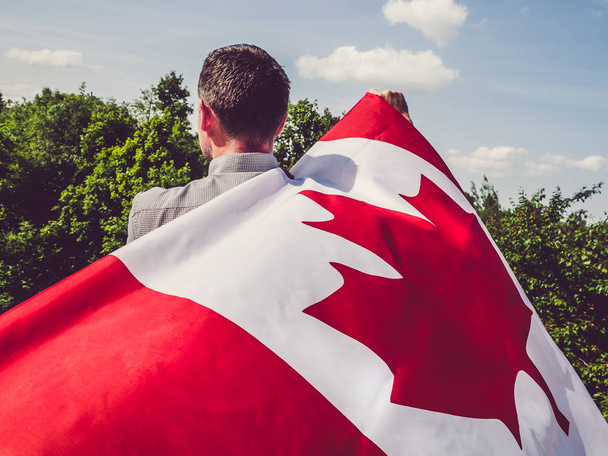 Man waving a Canadian Flag. National holiday - 写真・画像