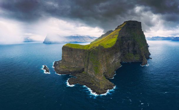 Aerial panorama of massive cliffs of Kalsoy on Faroe Islands - Photo, Image