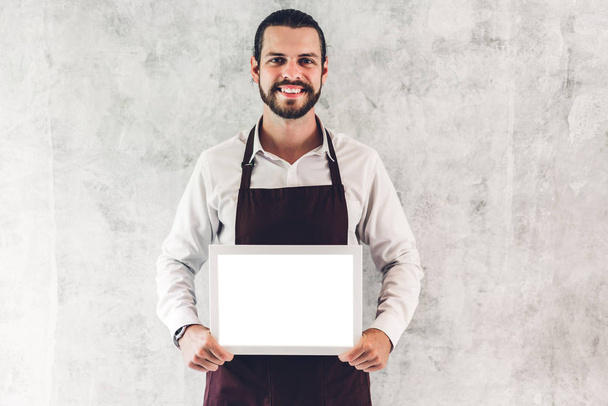 Portrait of handsome bearded barista man small business owner sm - Foto, immagini