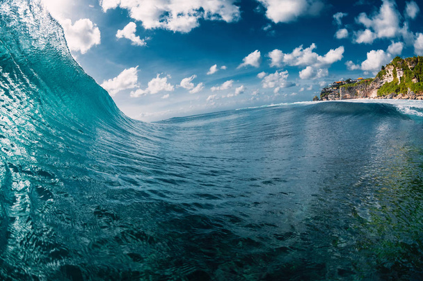 Surfing wave in ocean. Breaking blue barrel - Photo, Image