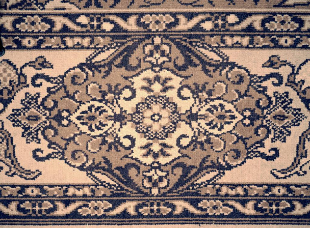 Carpet texture. Worn places with faded flowers - Photo, Image