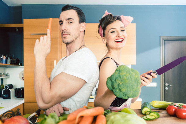 Couple making salad and cooking together - Photo, Image