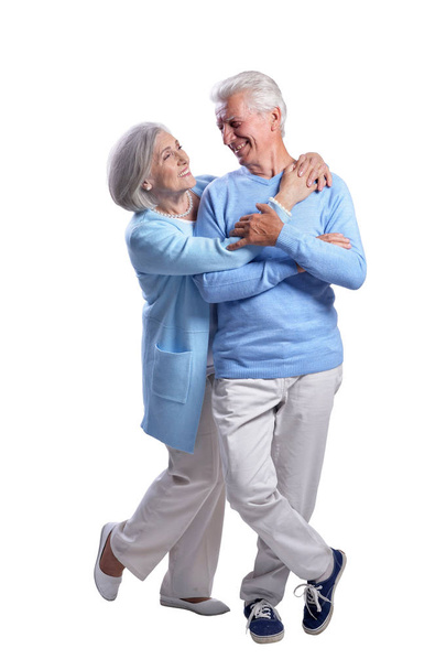 happy senior couple embracing isolated on white background - Zdjęcie, obraz