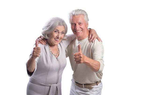 happy senior couple  with thumbs up  isolated on white background - Foto, imagen