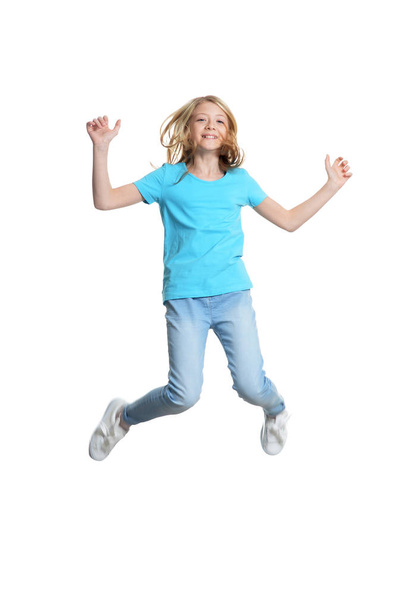  cute little girl jumping  isolated on white background - Fotó, kép