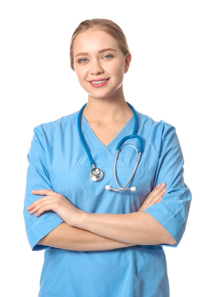 Young medical assistant on white background - Valokuva, kuva
