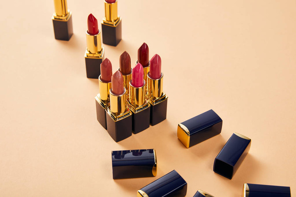 various shades of lipsticks on beige - Valokuva, kuva