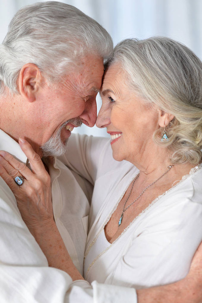 portrait of a happy senior couple hugging  at home - Foto, Imagen