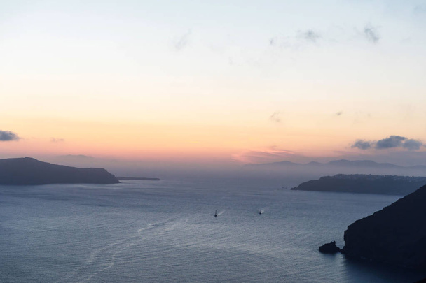 Elevated incredibly romantic sunset scene on Santorini. Shortly before the sunset - Photo, Image