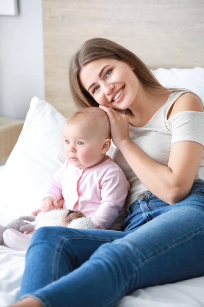 Happy mother with cute little baby at home - Foto, Bild