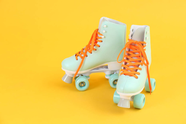 Vintage roller skates on color background - Foto, immagini