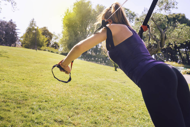 fitness woman training with suspension straps - Zdjęcie, obraz