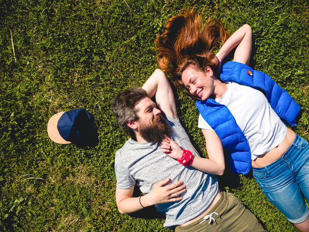 Couple on the grass in the park - 写真・画像
